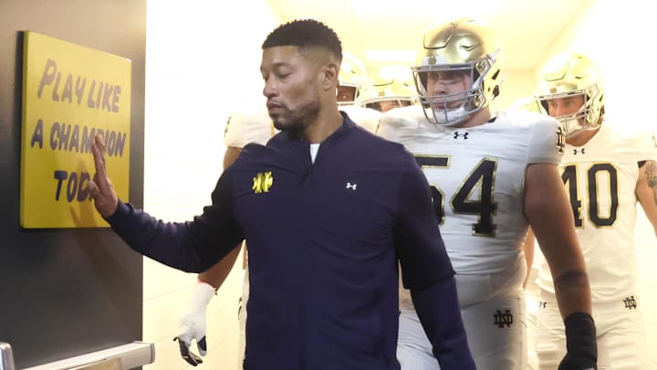 Nov 15, 2025; Pittsburgh, Pennsylvania, USA;  Notre Dame Fighting Irish head coach Marcus Freeman leads the team from the locker room to play the Pittsburgh Panthers at Acrisure Stadium. 
