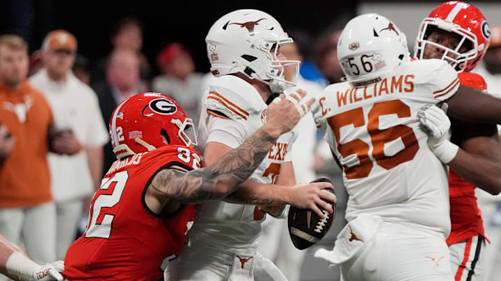 Georgia linebacker Chaz Chambliss (32) gets to Texas quarterback Quinn Ewers (3) during the first half of the SEC championship game against Texas in Atlanta, on Saturday, Dec. 7, 2024.