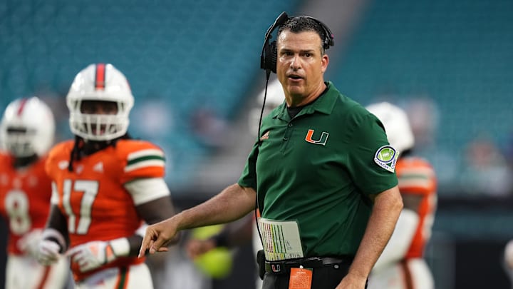 Sep 24, 2022; Miami Gardens, Florida, USA; Miami Hurricanes head coach Mario Cristobal walks onto the field.