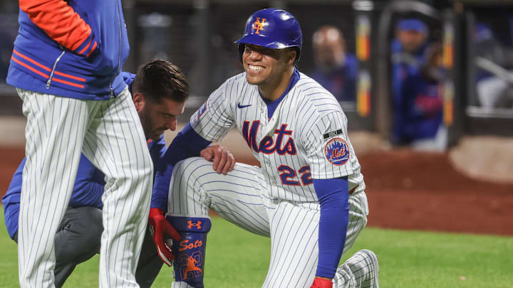 New York Mets designated hitter Juan Soto (22) reacts after fouling a ball off of his foot in the third inning against the Detroit Tigers at Citi Field. Mandatory Credit: Wendell Cruz-Imagn Images