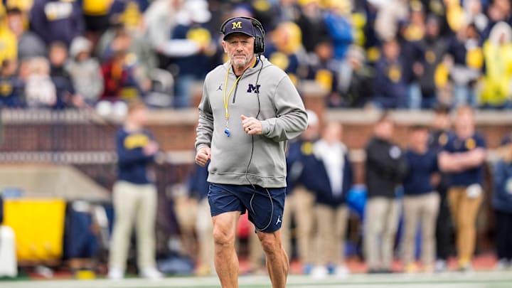 Michigan head coach Kyle Whittingham runs across the field during the spring game at Michigan Stadium in Ann Arbor on Saturday, April 18, 2026.