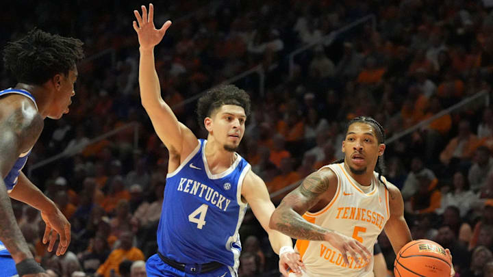Tennessee's Zakai Zeigler (5) moves the ball while guarded by Kentucky's Koby Brea (4) during an NCAA college basketball game on Tuesday, Jan. 28, 2025, in Knoxville, Tenn.