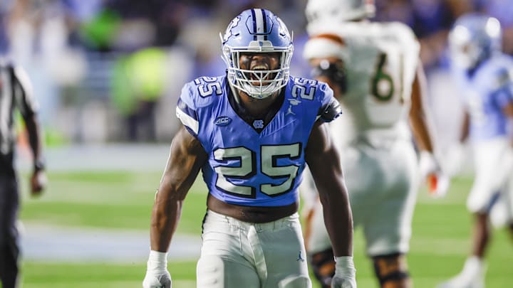 Oct 14, 2023; Chapel Hill, North Carolina, USA; North Carolina Tar Heels linebacker Kaimon Rucker (25) celebrates after sacking the Miami Hurricanes quarterback in the second half at Kenan Memorial Stadium. Mandatory Credit: Nell Redmond-USA TODAY Sports