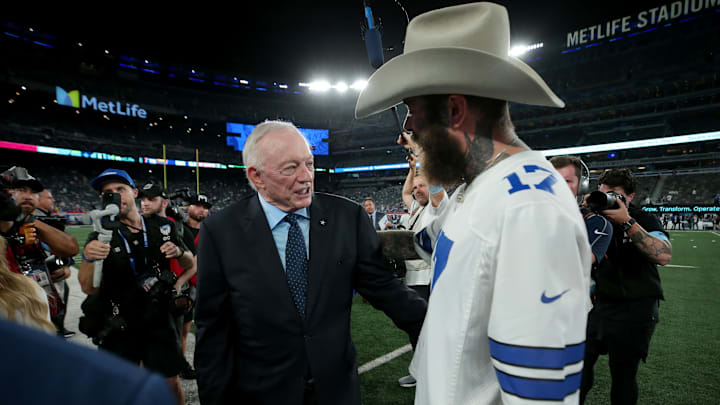 Sep 26, 2024; East Rutherford, New Jersey, USA; Dallas Cowboys owner Jerry Jones (left) greets American recording artist Post Malone on the field before a game against the New York Giants at MetLife Stadium.