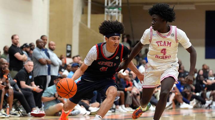 Florida Rebels Cayden Daughtry (3) moves towards the basket as Team Herro Takis Tyler (4) defends during the Florida Rebels and Team Herro semifinal basketball game at the 2026 Nike Peach Jam in North Augusta, S.C., on Saturday, July 18, 2026. The Florida Rebels won 84-76 and advance to the championship tomorrow.