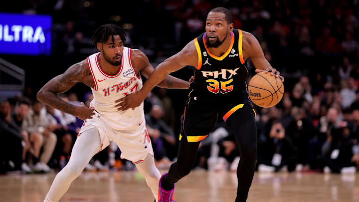 Dec 27, 2023; Houston, Texas, USA; Phoenix Suns forward Kevin Durant (35) handles the ball against Houston Rockets forward Tari Eason (17) during the game at Toyota Center. Mandatory Credit: Erik Williams-Imagn Images