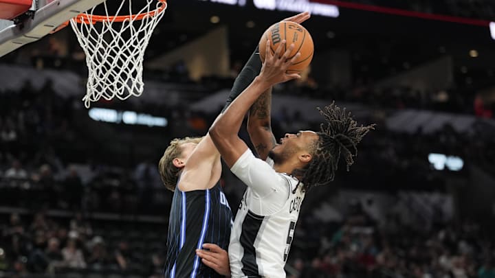 Orlando Magic center Moritz Wagner (21) blocks a shot by San Antonio Spurs guard Stephon Castle (5) in the first half at Frost Bank Center.