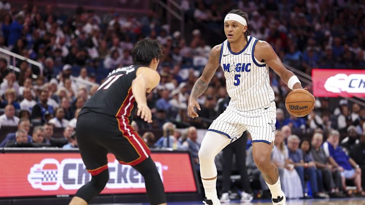 Oct 22, 2025; Orlando, Florida, USA; Orlando Magic forward Paolo Banchero (5) controls the ball against the Miami Heat in the third quarter at Kia Center. Mandatory Credit: Nathan Ray Seebeck-Imagn Images