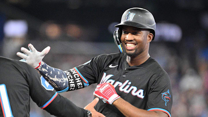 Sep 28, 2024; Toronto, Ontario, CAN;   Miami Marlins right fielder Jesus Sanchez (12) celebrates after hitting a single against the Toronto Blue Jays in the eighth inning at Rogers Centre. Mandatory Credit: Dan Hamilton-Imagn Images