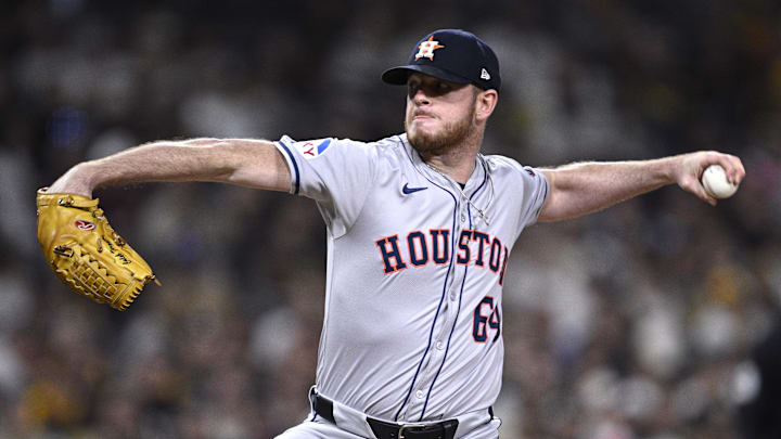 Sep 16, 2024; San Diego, California, USA; Houston Astros relief pitcher Caleb Ferguson (64) pitches against the San Diego Padres during the eighth inning at Petco Park. Mandatory Credit: Orlando Ramirez-Imagn Images