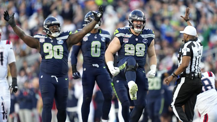 Feb 8, 2026; Santa Clara, CA, USA; Seattle Seahawks defensive tackle Rylie Mills (98) reacts after sacking New England Patriots quarterback Drake Maye (10) during the second quarter in Super Bowl LX at Levi's Stadium. 