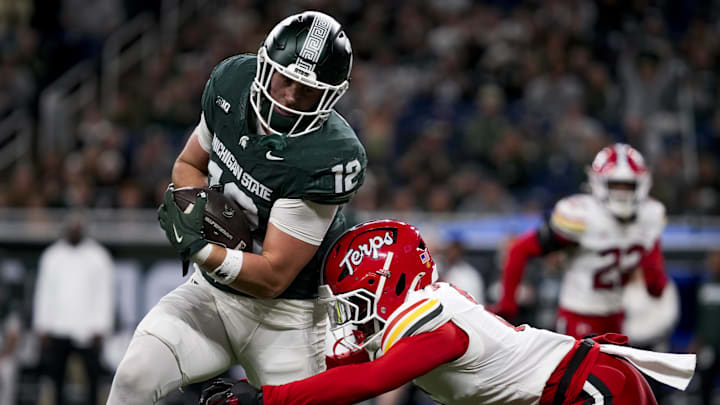 Nov 29, 2025; Detroit, Michigan, USA; Maryland defensive back Dontay Joyner (6) tackles Michigan State tight end Jack Velling (12) in the second quarter at Ford Field. Mandatory Credit: Brendan Mullin-Imagn Images