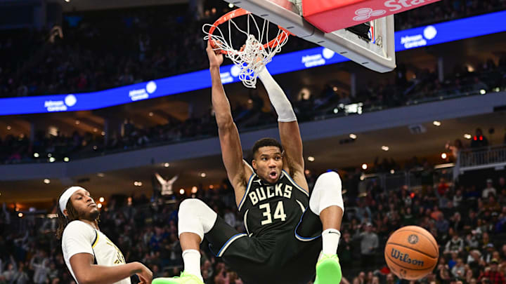 Nov 22, 2024; Milwaukee, Wisconsin, USA; Milwaukee Bucks forward Giannis Antetokounmpo (34) dunks a basket against Indiana Pacers center Myles Turner (33)) in the fourth quarter at Fiserv Forum. Mandatory Credit: Benny Sieu-Imagn Images