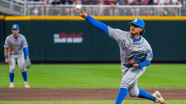 Jun 17, 2025; Omaha, Neb, USA; UCLA Bruins starting pitcher Cody Delvecchio (2) pitches against the Arkansas Razorbacks during the third inning at Charles Schwab Field. Mandatory Credit: Dylan Widger-Imagn Images