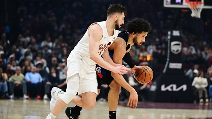 Jan 27, 2025; Cleveland, Ohio, USA; Detroit Pistons guard Cade Cunningham (2) brings the ball up court against Cleveland Cavaliers guard Ty Jerome (2) : Ken Blaze-Imagn Images