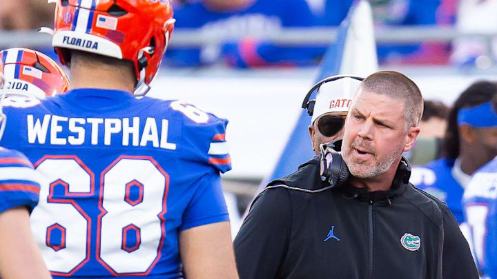 Florida Gators head coach Billy Napier talks to his team during a timeout during the first half at Raymond James Stadium in Tampa, FL on Friday, December 20, 2024 in the 2024 Union Home Mortgage Gasparilla Bowl. [Doug Engle/Gainesville Sun]