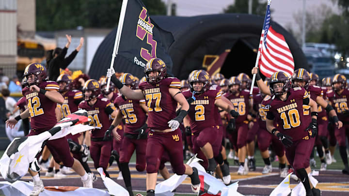 Walsh Jesuit runs onto the field before a win against Archbishop Hoban on October 4, 2024.