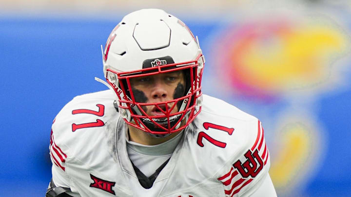 Utah Utes offensive lineman Caleb Lomu (71) gets ready before the snap. Utah Utes offensive lineman Caleb Lomu (71) gets ready before the snap.