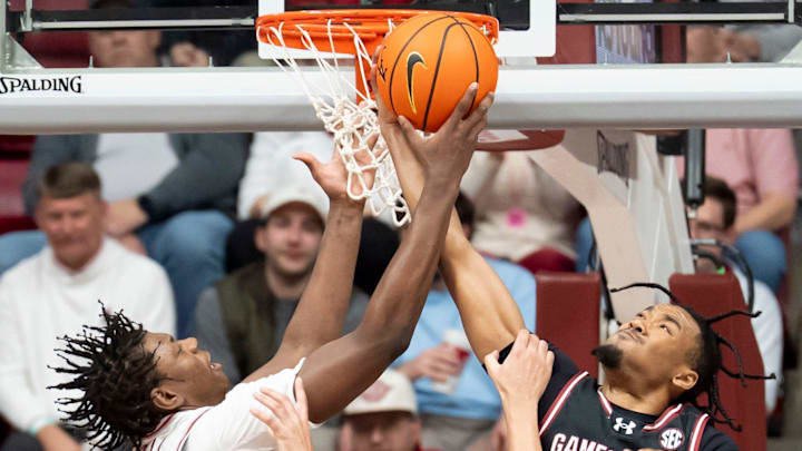 Feb 14, 2026; Tuscaloosa, AL, USA; Alabama forward Aiden Sherrell (22)and South Carolina guard Kobe Knox (4) vie for a rebound at Coleman Coliseum. Alabama defeated South Carolina 89-75. Mandatory Credit: Gary Cosby Jr.-Tuscaloosa News