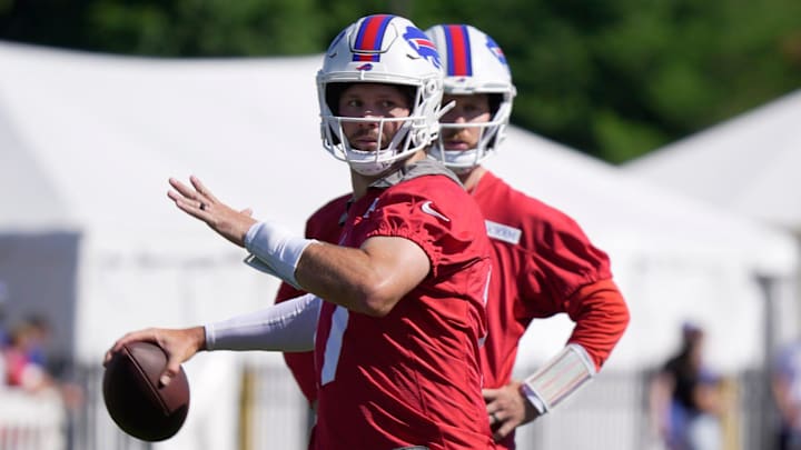 Bills quarterback Josh Allen gets ready to throw a pass while backup quarterback Shane Buechele watches during the Buffalo Bills training camp at St. John Fisher University in Pittsford on July 23, 2025.
