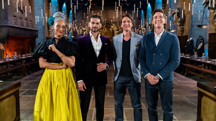 Judges Carla Hall and Jozef Youssef with Hosts James and Oliver Phelps in The Great Hall, as seen on Harry Potter: Wizards of Baking, Season 1.