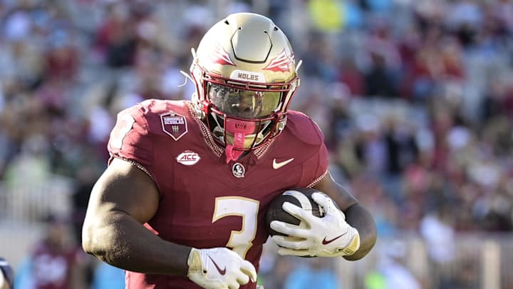 Nov 23, 2024; Tallahassee, Florida, USA; Florida State Seminoles running back Kam Davis (3) runs the ball during the second half of the game against the Charleston Southern Buccaneers at Doak S. Campbell Stadium. Mandatory Credit: Melina Myers-Imagn Images