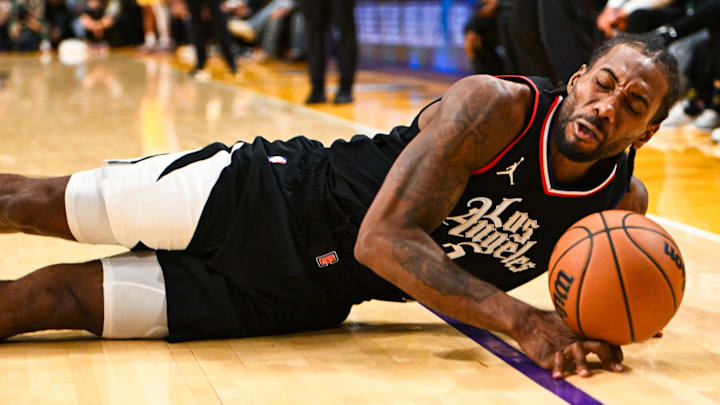 Nov 1, 2023; Los Angeles, California, USA;  LA Clippers forward Kawhi Leonard (2) falls after being fouled by Los Angeles Lakers forward LeBron James (23) (not pictured) during the fourth quarter at Crypto.com Arena. Mandatory Credit: Jonathan Hui-Imagn Images