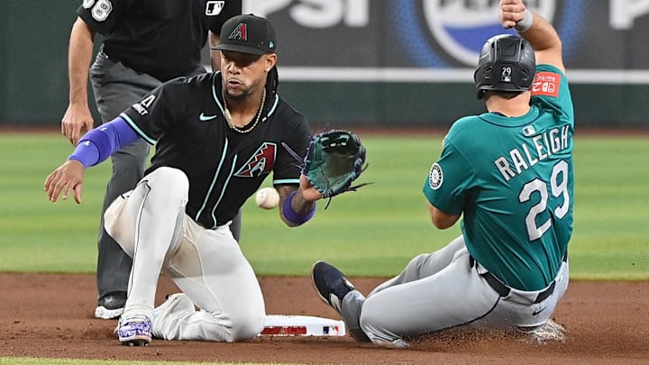 Seattle Mariners catcher Cal Raleigh (right) is caught stealing second during a game against the Arizona Diamondbacks on June 11 at Chase Field. Seattle Mariners catcher Cal Raleigh (right) is caught stealing second during a game against the Arizona Diamondbacks on June 11 at Chase Field.