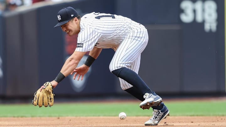 Apr 13, 2025; Bronx, New York, USA; New York Yankees shortstop Anthony Volpe (11) is unable to make a play on a ground ball in the sixth inning against the San Francisco Giants at Yankee Stadium. Mandatory Credit: Wendell Cruz-Imagn Images