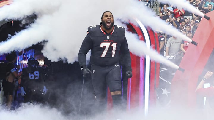 Dec 15, 2024; Houston Texans offensive tackle Tytus Howard (71) runs onto the field before the game against the Miami Dolphins at NRG Stadium. Mandatory Credit: Troy Taormina-Imagn Images
