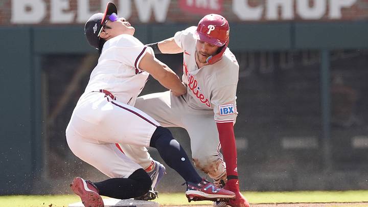 Sep 29, 2026; Cumberland, Georgia, USA;  Philadelphia Phillies shortstop Trea Turner (7) is tagged out by Atlanta Braves shortstop Ha-Seong Kim (7) in the third inning during game one of the Wildcard round for the 2026 MLB Playoffs at Truist Park.  Mandatory Credit: Dale Zanine-Imagn Images