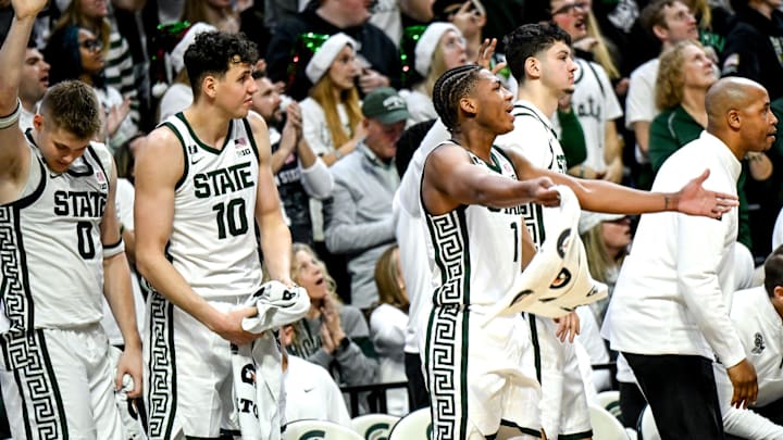 Michigan State's Jeremy Fears Jr., right, and the Spartans bench celebrate Jase Richardson's 3-pointer against Nebraska during the second half on Saturday, Dec. 7, 2024, at the Breslin Center in East Lansing.