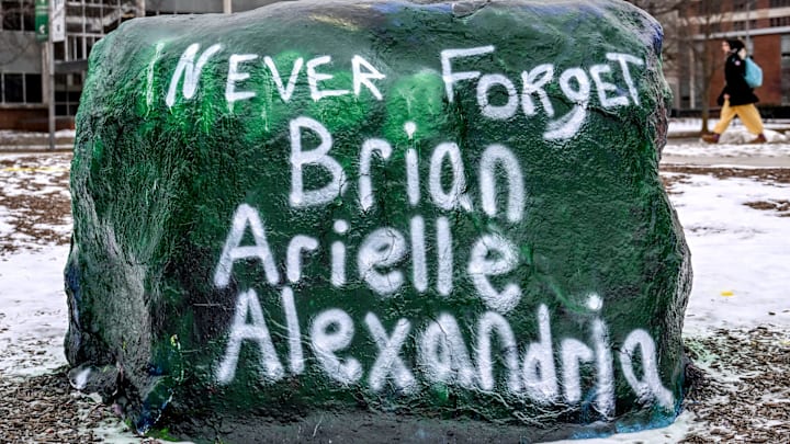 The Rock is painted as a tribute to the victims of Michigan State University shooting, Brian Fraser Arielle Anderson, and Alexandria Verner, on Wednesday, Feb. 12, 2025, on the MSU campus in East Lansing.