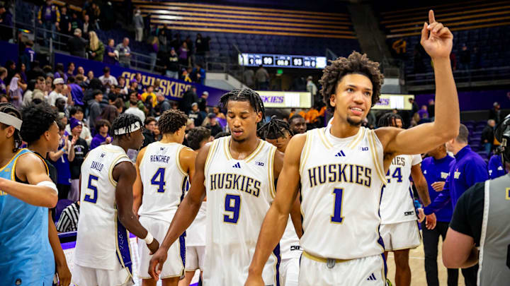 Desmond Claude (1) celebrates the Huskies' 2 OT win over Southern.