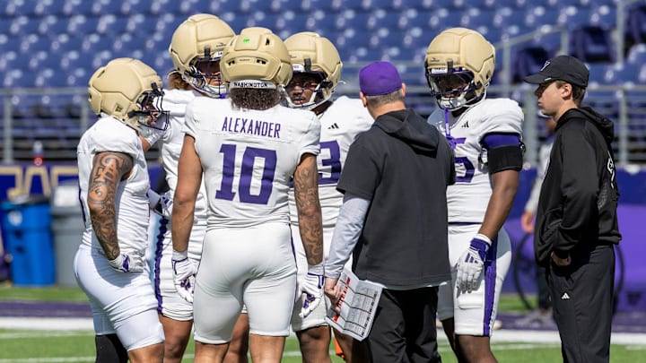 Husky linebackers meet during spring ball. 