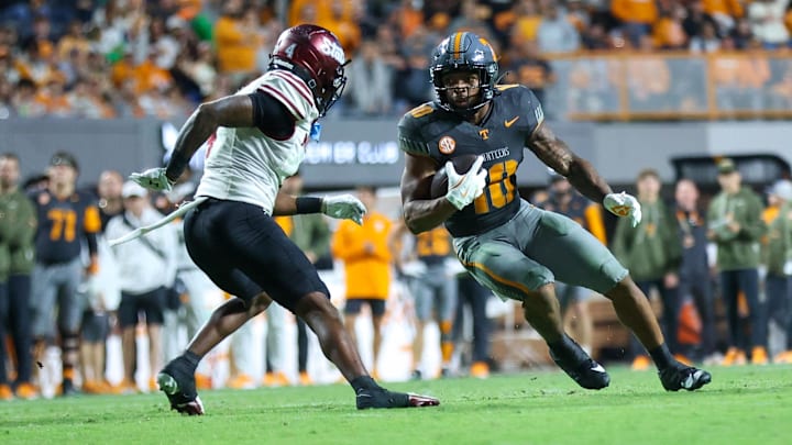 Nov 15, 2025; Knoxville, Tennessee, USA;  Tennessee Volunteers running back Desean Bishop (18) runs the ball against the New Mexico State Aggies during the second half at Neyland Stadium. Mandatory Credit: Randy Sartin-Imagn Images