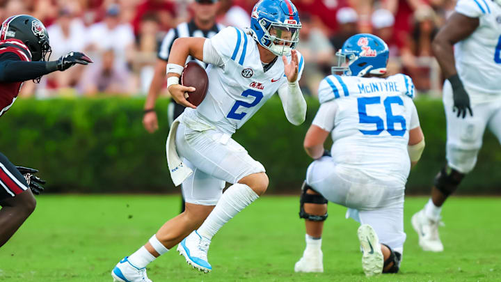 Oct 5, 2024; Columbia, South Carolina, USA; Mississippi Rebels quarterback Jaxson Dart (2) rushes against the South Carolina Gamecocks in the second quarter at Williams-Brice Stadium. Mandatory Credit: Jeff Blake-Imagn Images Oct 5, 2024; Columbia, South Carolina, USA; Mississippi Rebels quarterback Jaxson Dart (2) rushes against the South Carolina Gamecocks in the second quarter at Williams-Brice Stadium. Mandatory Credit: Jeff Blake-Imagn Images