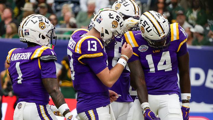 Dec 31, 2024; Houston, TX, USA; LSU Tigers quarterback Garrett Nussmeier (13) celebrates tight end Trey'Dez Green (14) touchdown reception against the Baylor Bears in the first quarter at NRG Stadium. Mandatory Credit: Thomas Shea-Imagn Images Dec 31, 2024; Houston, TX, USA; LSU Tigers quarterback Garrett Nussmeier (13) celebrates tight end Trey'Dez Green (14) touchdown reception against the Baylor Bears in the first quarter at NRG Stadium. Mandatory Credit: Thomas Shea-Imagn Images