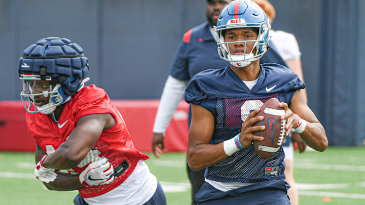 Quarterback Austin Simmons (8) throws a pass at Ole Miss football practice in Oxford, Miss., on