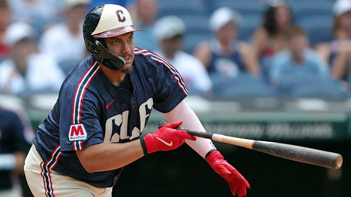 Cleveland Guardians first baseman Josh Naylor (22) watches his shot to right field for a double during the fifth inning of an MLB game against the Seattle Mariners at Progressive Field, Thursday, June 20, 2024, in Cleveland, Ohio.