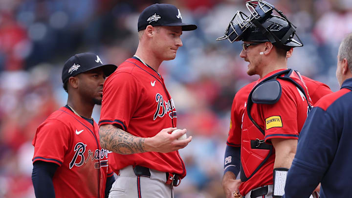 May 29, 2025; Philadelphia, Pennsylvania, USA; Atlanta Braves pitcher AJ Smith-Shawver (32) talks with catcher Sean Murphy (12) before leaving the game during the third inning against the Philadelphia Phillies at Citizens Bank Park. Mandatory Credit: Bill Streicher-Imagn Images