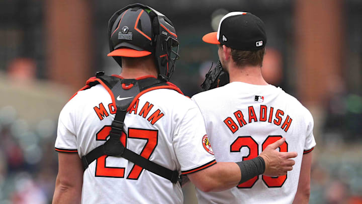May 15, 2024; Baltimore, Maryland, USA; Baltimore Orioles pitcher Kyle Bradish (38) is visited by catcher James McCann (27) in the third inning against the Toronto Blue Jays at Oriole Park at Camden Yards