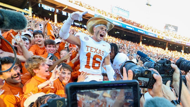 Oct 12, 2024; Dallas, Texas, USA;  Texas Longhorns defensive back Michael Taaffe (16) celebrates with fans after the game against the Oklahoma Sooners at the Cotton Bowl.