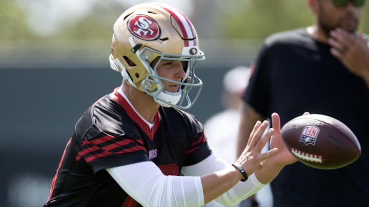 Jul 23, 2025; Santa Clara, CA, USA; San Francisco 49ers quarterback Brock Purdy (13) drills with his teammates during the first day of training camp at SAP Performance Facility. Mandatory Credit: D. Ross Cameron-Imagn Images Jul 23, 2025; Santa Clara, CA, USA; San Francisco 49ers quarterback Brock Purdy (13) drills with his teammates during the first day of training camp at SAP Performance Facility. Mandatory Credit: D. Ross Cameron-Imagn Images