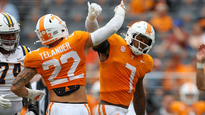 Sep 6, 2025; Knoxville, Tennessee, USA; Tennessee Volunteers linebacker Jeremiah Telander (22) and  linebacker Arion Carter (7) react to a play against the East Tennessee State Buccaneers during the second half at Neyland Stadium. Mandatory Credit: Randy Sartin-Imagn Images