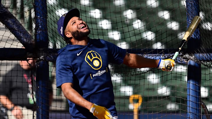 Oct 3, 2024; Milwaukee, Wisconsin, USA;  Milwaukee Brewers outfielder Jackson Chourio (11) warms up before the game three of the Wildcard round against the New York Mets in the 2024 MLB Playoffs at American Family Field. Mandatory Credit: Benny Sieu-Imagn Images