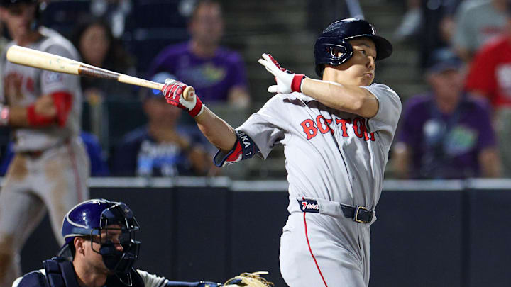 Sep 20, 2025; Tampa, Florida, USA; Boston Red Sox designated hitter Masataka Yoshida (7) hits an rbi single against the Tampa Bay Rays in the ninth inning at George M. Steinbrenner Field. Mandatory Credit: Nathan Ray Seebeck-Imagn Images