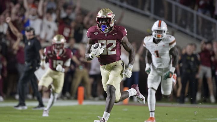 Oct 4, 2025; Tallahassee, Florida, USA; Florida State Seminoles running back Ousmane Kromah (32) runs during the first half against the Miami Hurricanes at Doak S. Campbell Stadium. Mandatory Credit: Melina Myers-Imagn Images