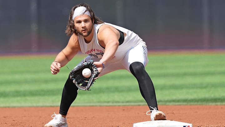 Sep 4, 2024; Toronto, Ontario, CAN; Toronto Blue Jays shortstop Bo Bichette (11) fields balls during batting practice before game against the Philadelphia Phillies at Rogers Centre.