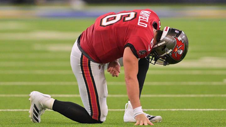 Nov 23, 2025; Inglewood, California, USA; Tampa Bay Buccaneers quarterback Baker Mayfield (6) kneels on the field with an apparent injury against the Los Angeles Rams during the second quarter at SoFi Stadium. Mandatory Credit: Jayne Kamin-Oncea-Imagn Images